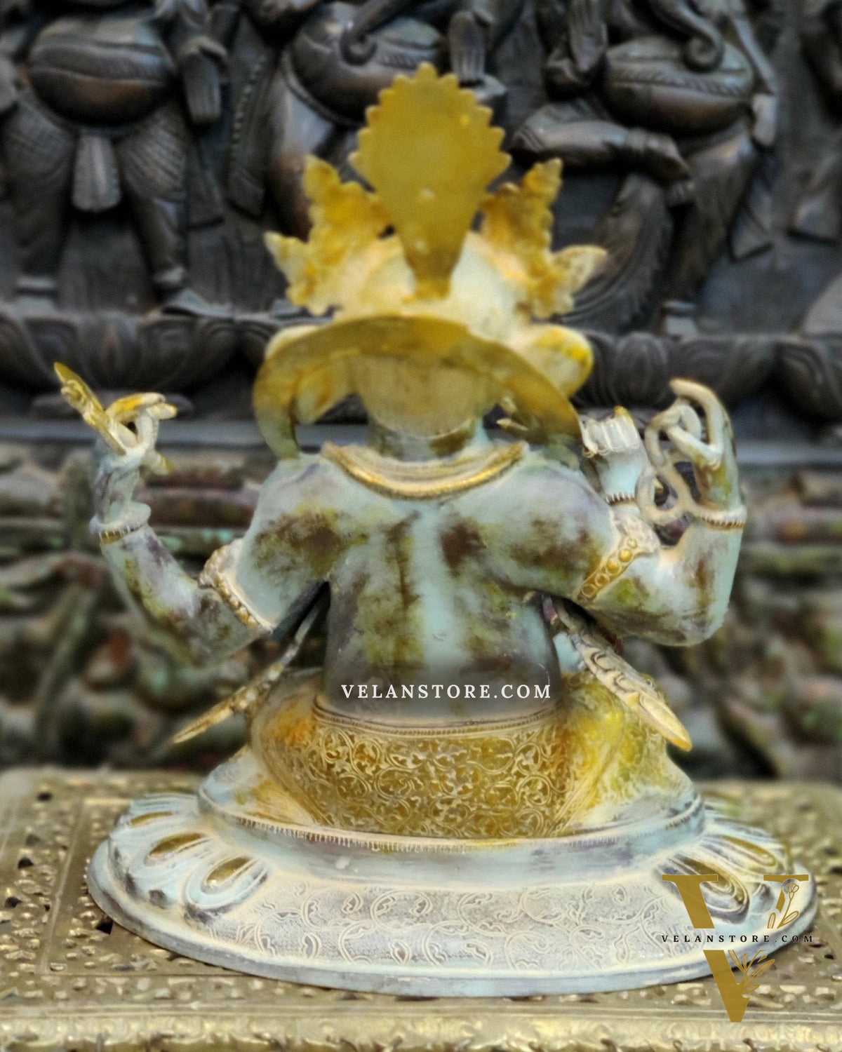 Brass Nepalese Style Ganesha seated on a round base.