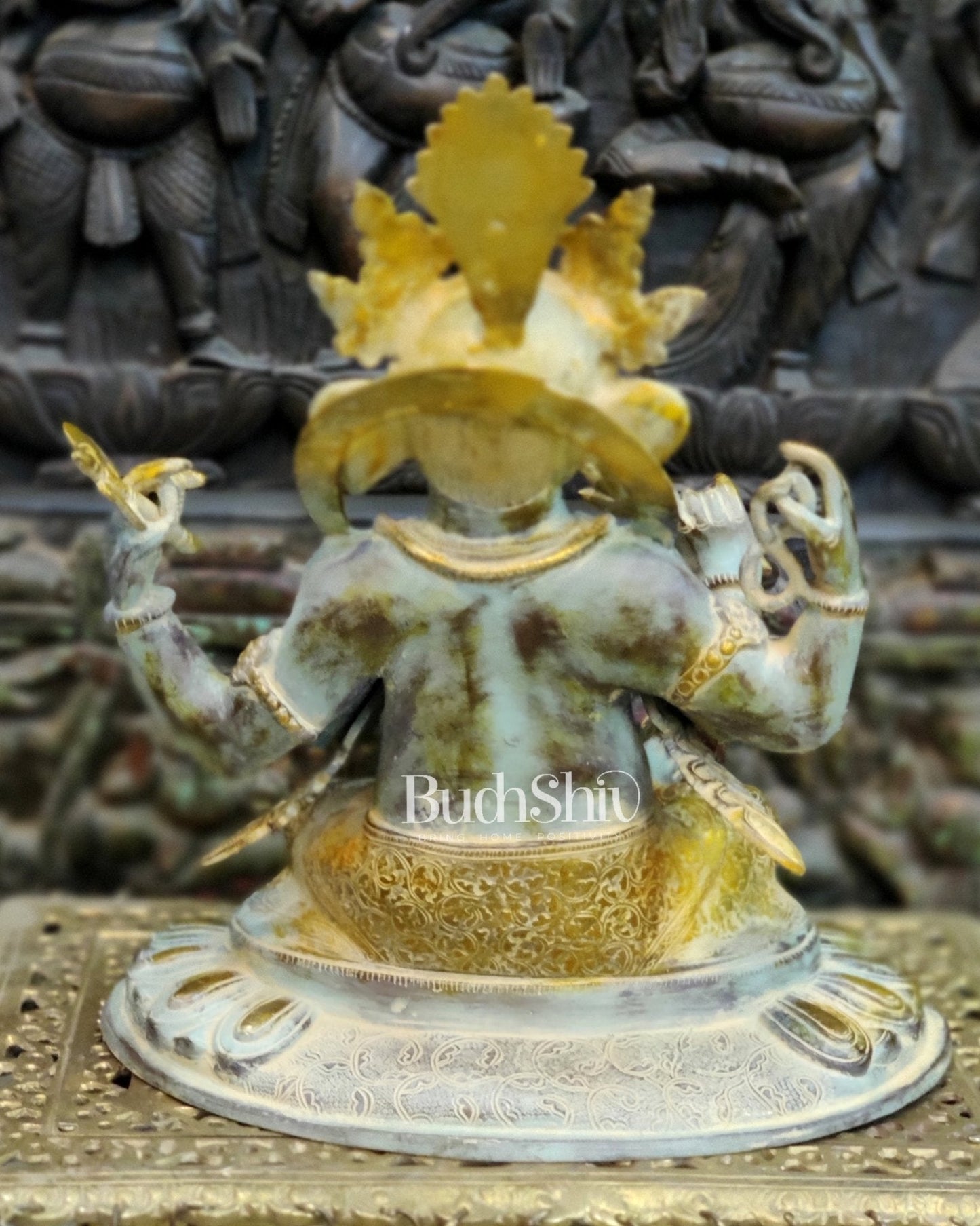 Brass Nepalese Style Ganesha seated on a round base.