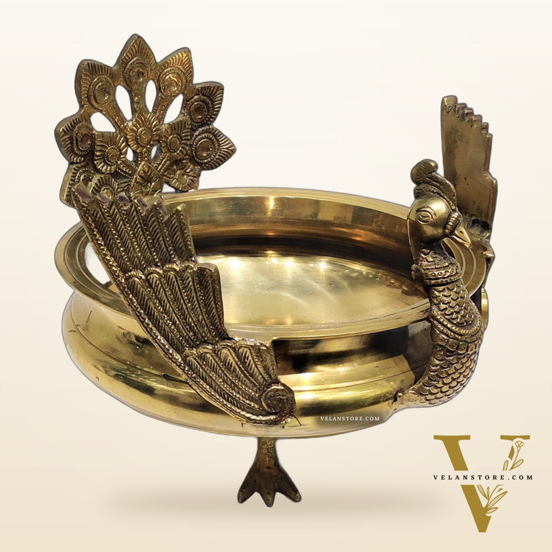 Brass peacock shaped urli golden