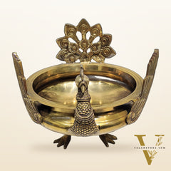 Brass peacock shaped urli golden