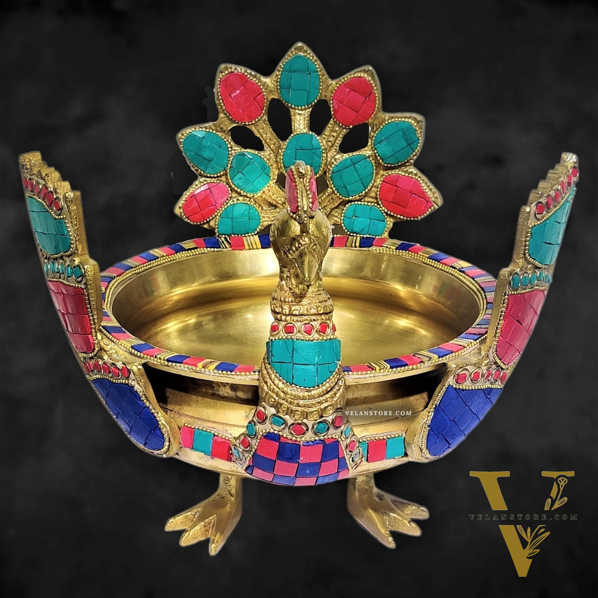 Brass peacock shaped urli with stonework