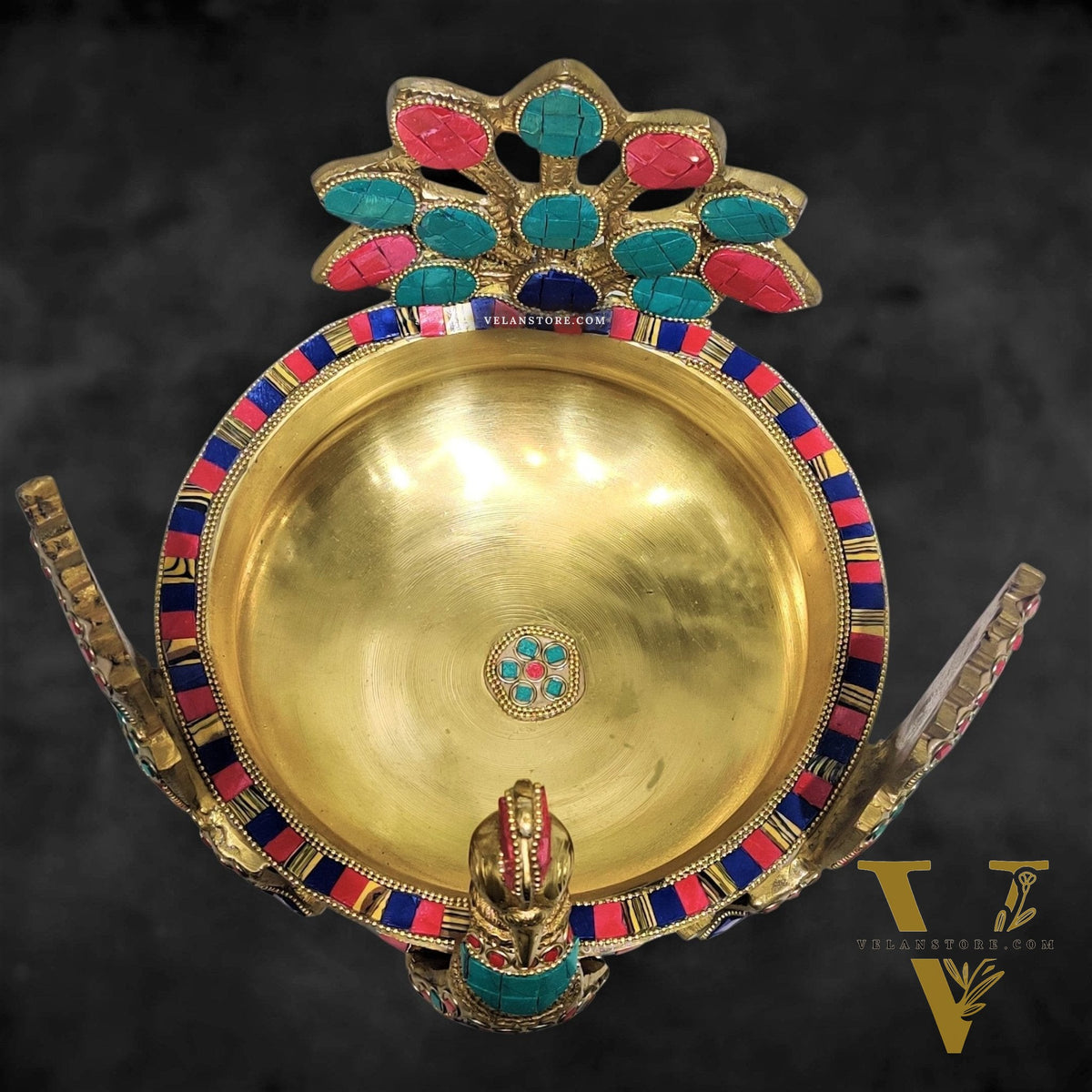 Brass peacock shaped urli with stonework