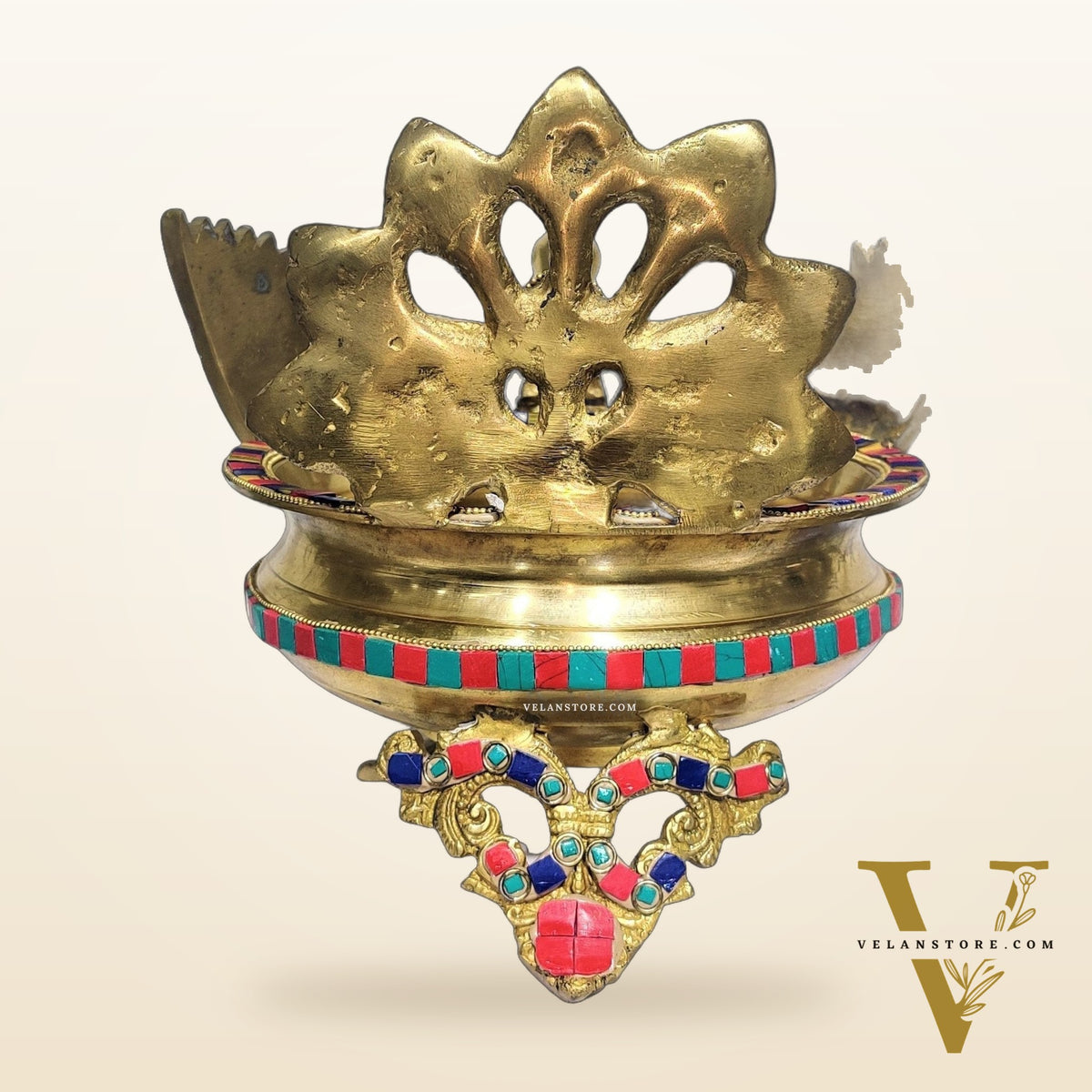 Brass peacock shaped urli with stonework