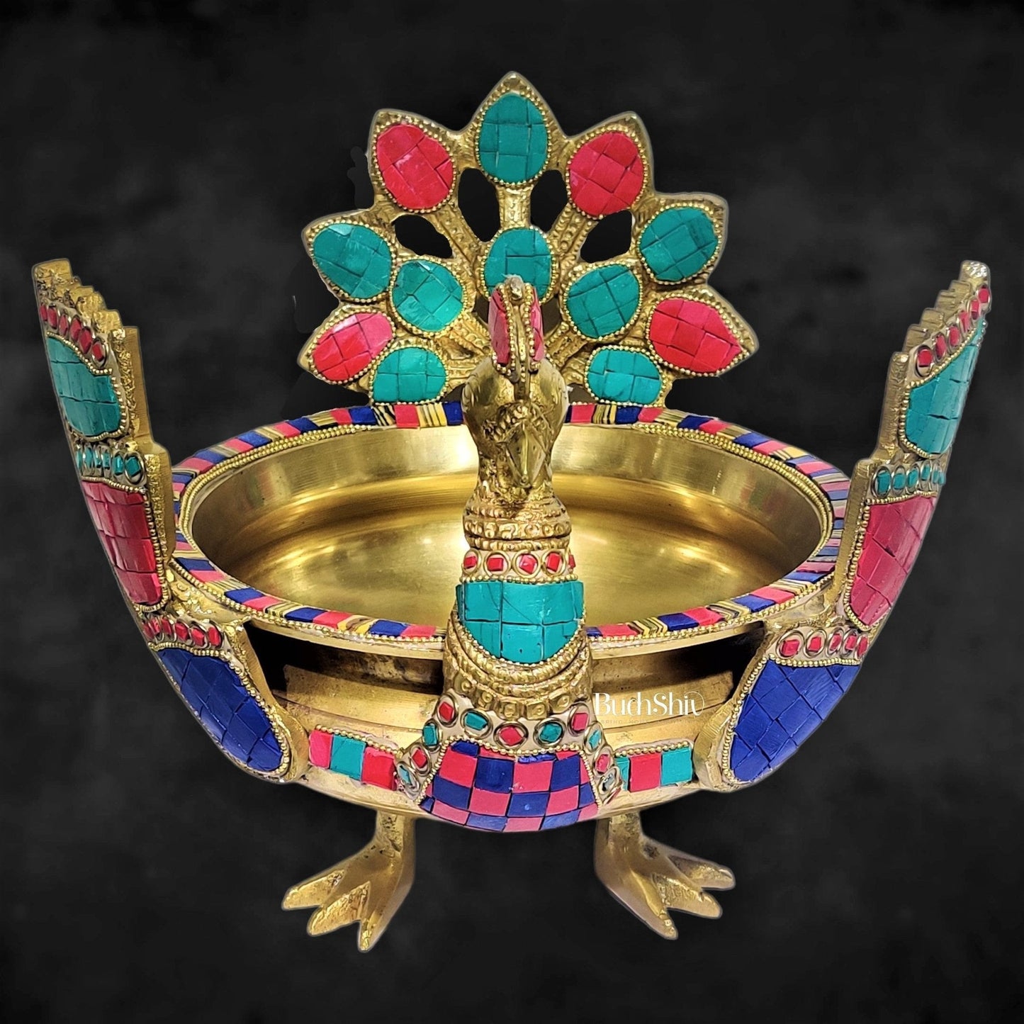 Brass peacock shaped urli with stonework