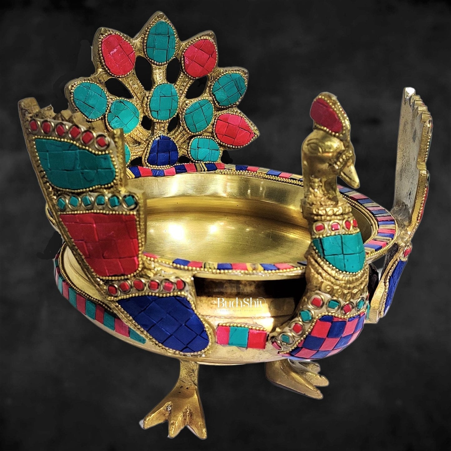 Brass peacock shaped urli with stonework