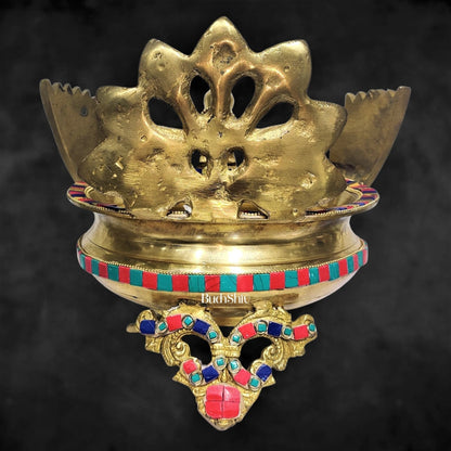 Brass peacock shaped urli with stonework