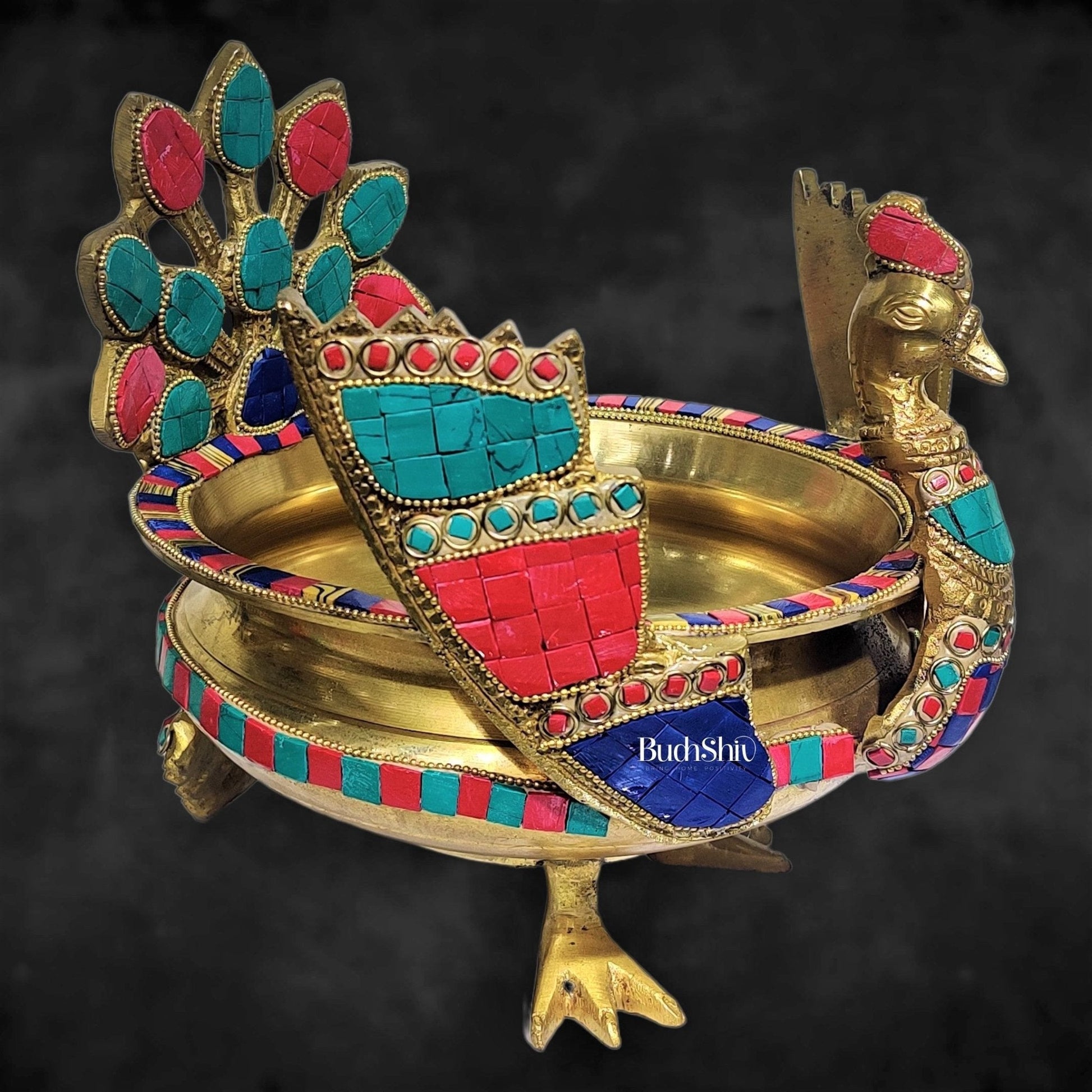 Brass peacock shaped urli with stonework