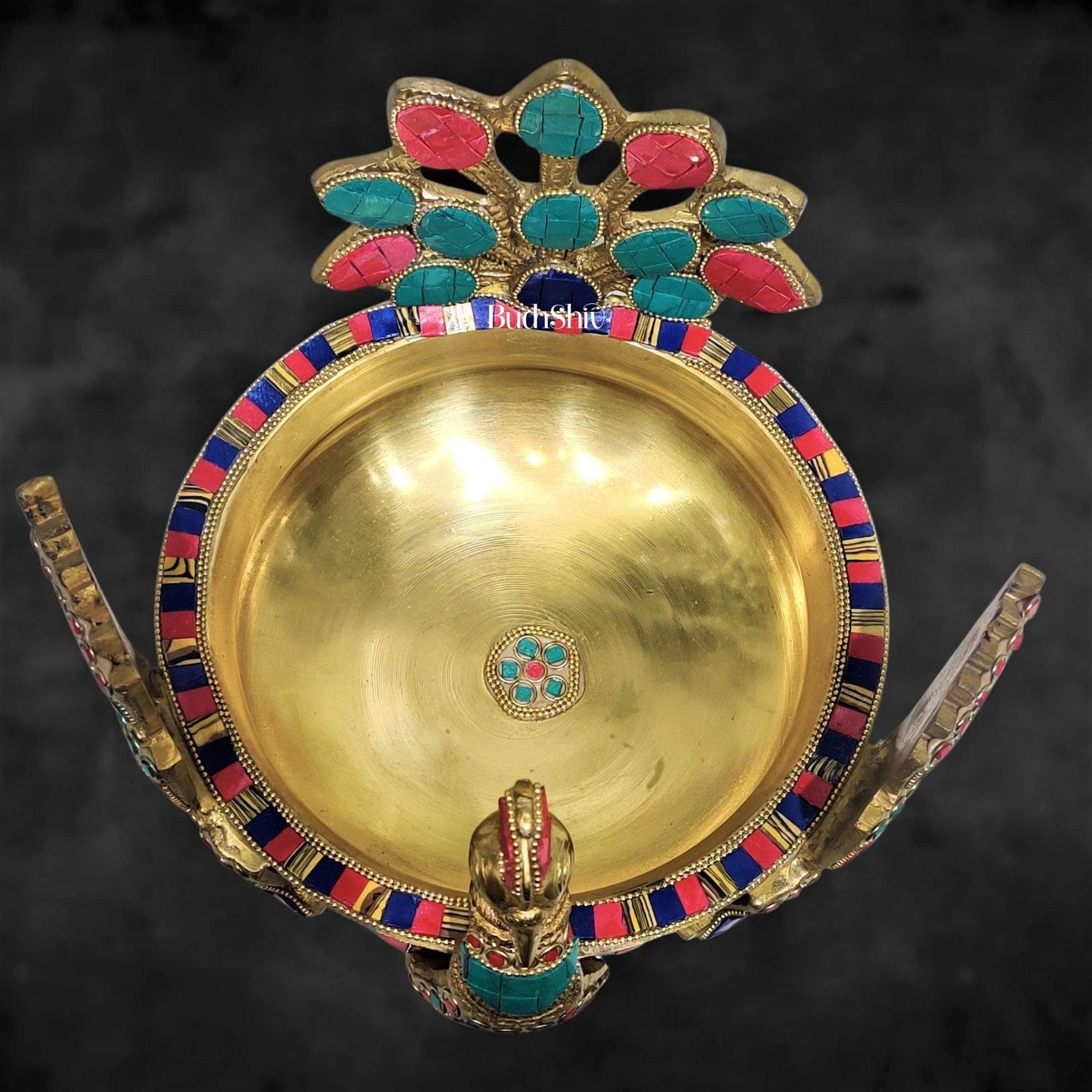 Brass peacock shaped urli with stonework