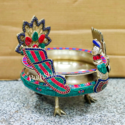 Brass peacock shaped urli with stonework