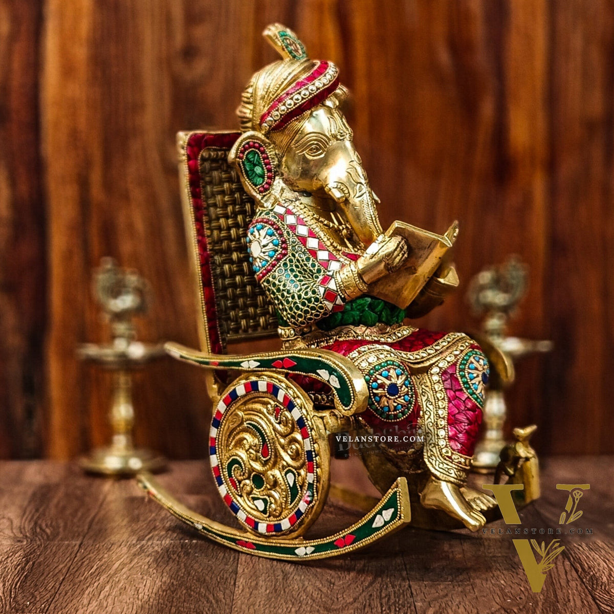 Brass reading Ganesha on Rock on Chair 17"
