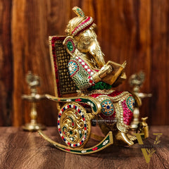 Brass reading Ganesha on Rock on Chair 17"
