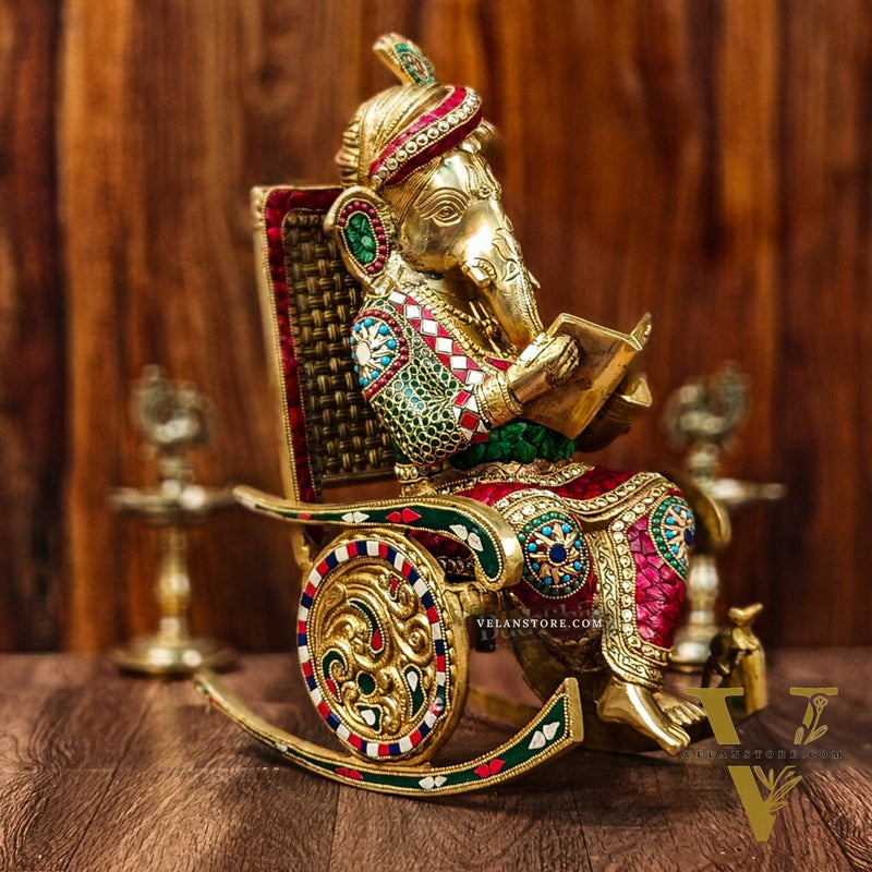 Brass reading Ganesha on Rock on Chair 17"