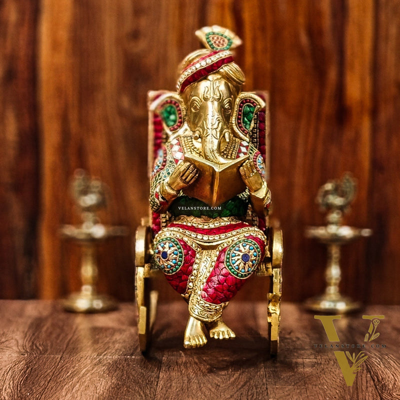 Brass reading Ganesha on Rock on Chair 17"