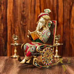 Brass reading Ganesha on Rock on Chair 17"