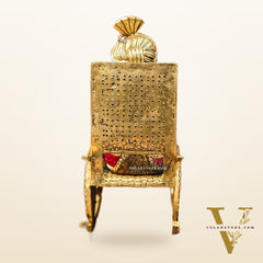 Brass reading Ganesha on Rock on Chair 17"