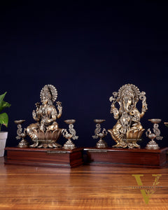 Brass Superfine Ganesh–Lakshmi Pair with Twin Peacock Lamps on Wooden Base – 9.5 Inch