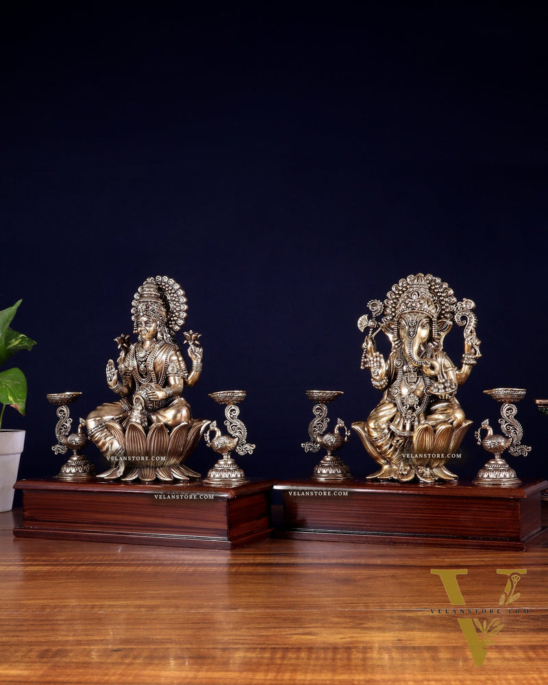 Brass Superfine Ganesh–Lakshmi Pair with Twin Peacock Lamps on Wooden Base – 9.5 Inch