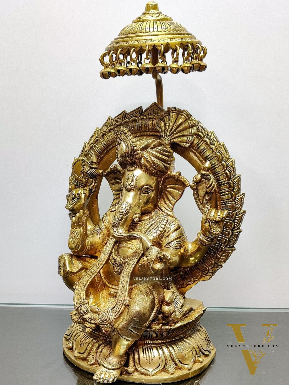 Brass Superfine Ganesha seated on a throne with umbrella 18 inch