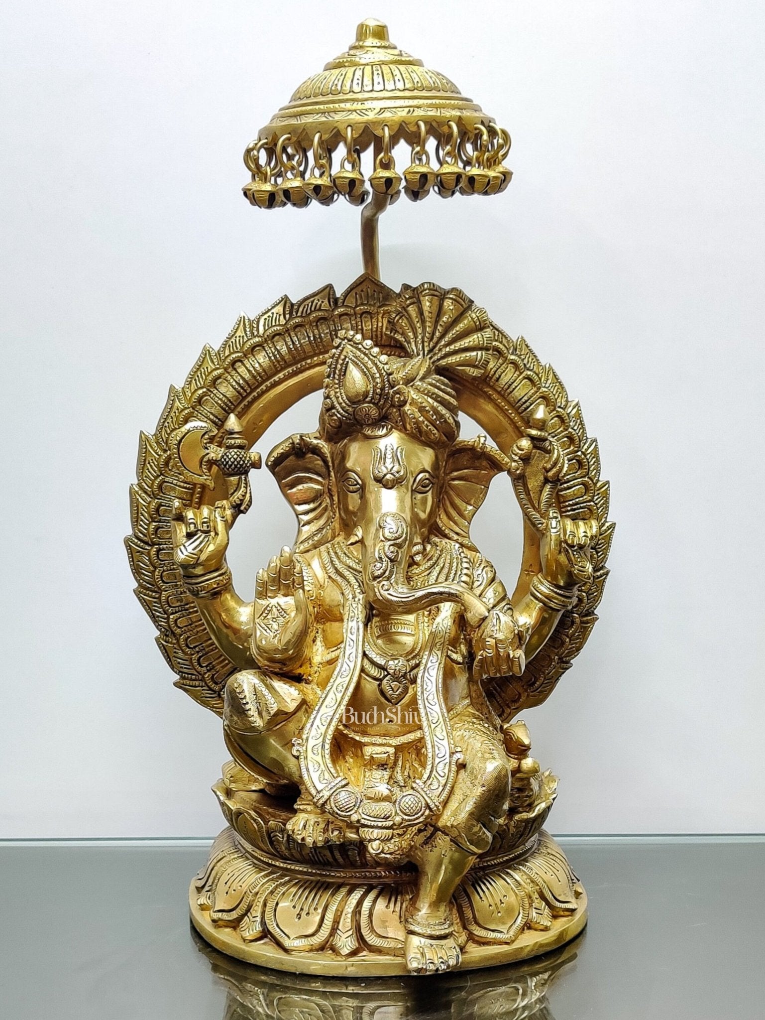 Brass Superfine Ganesha seated on a throne with umbrella 18 inch