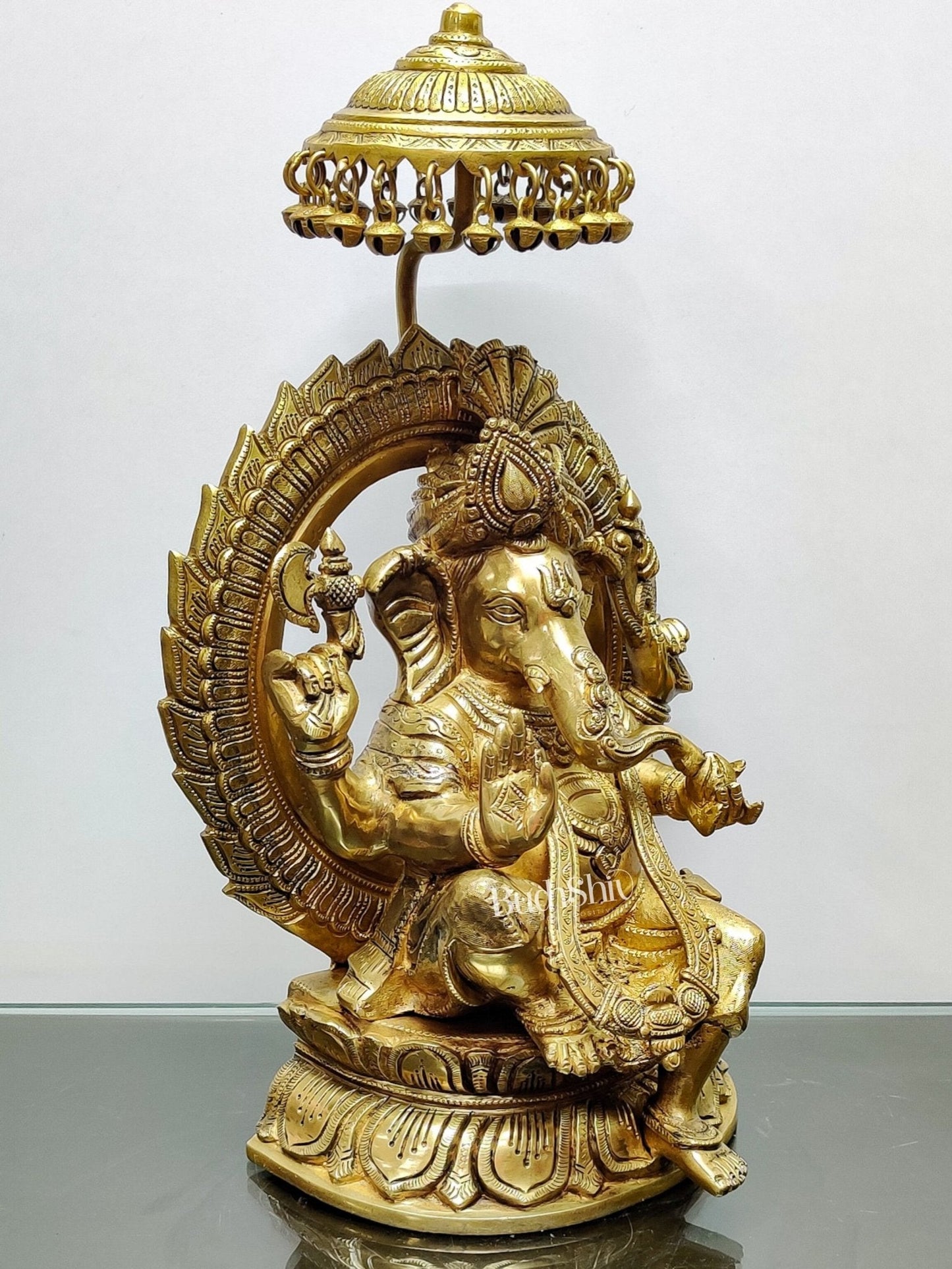 Brass Superfine Ganesha seated on a throne with umbrella 18 inch