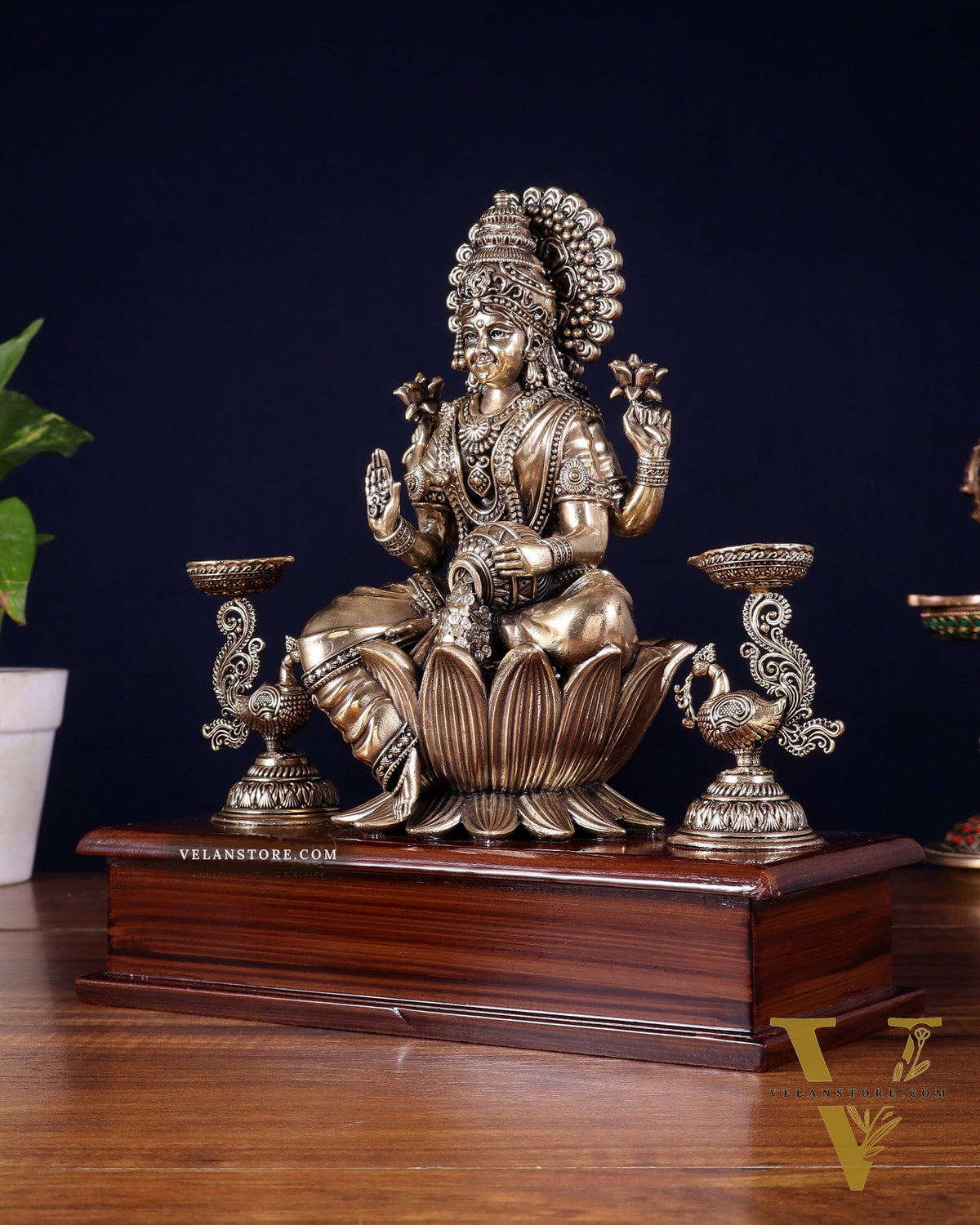 Brass Superfine Goddess Lakshmi Idol with Twin Peacock Lamps on Wooden Base – 9.5 Inch