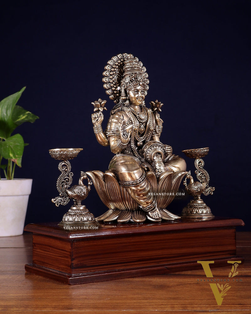 Brass Superfine Goddess Lakshmi Idol with Twin Peacock Lamps on Wooden Base – 9.5 Inch