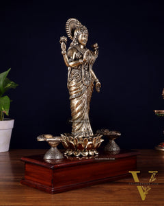 Brass Superfine Goddess Lakshmi Standing on Wooden Base with Diyas – 12.5 Inch