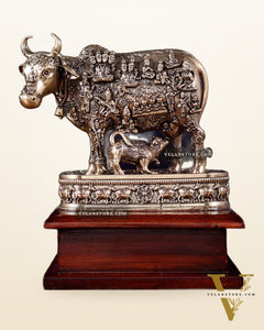 Brass Superfine Kamdhenu Cow with Calf – All Gods Engraved on Wooden Base (8.5 Inch)