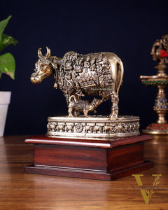 Brass Superfine Kamdhenu Cow with Calf – All Gods Engraved on Wooden Base (8.5 Inch)