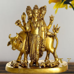 Brass Three faced Dattatreya guru with a cow and four dogs.