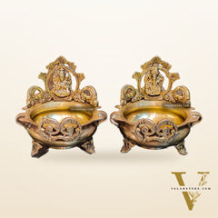 Divine Pair: Lord Ganesha and Goddess Lakshmi Brass Statues on Decorative Urli