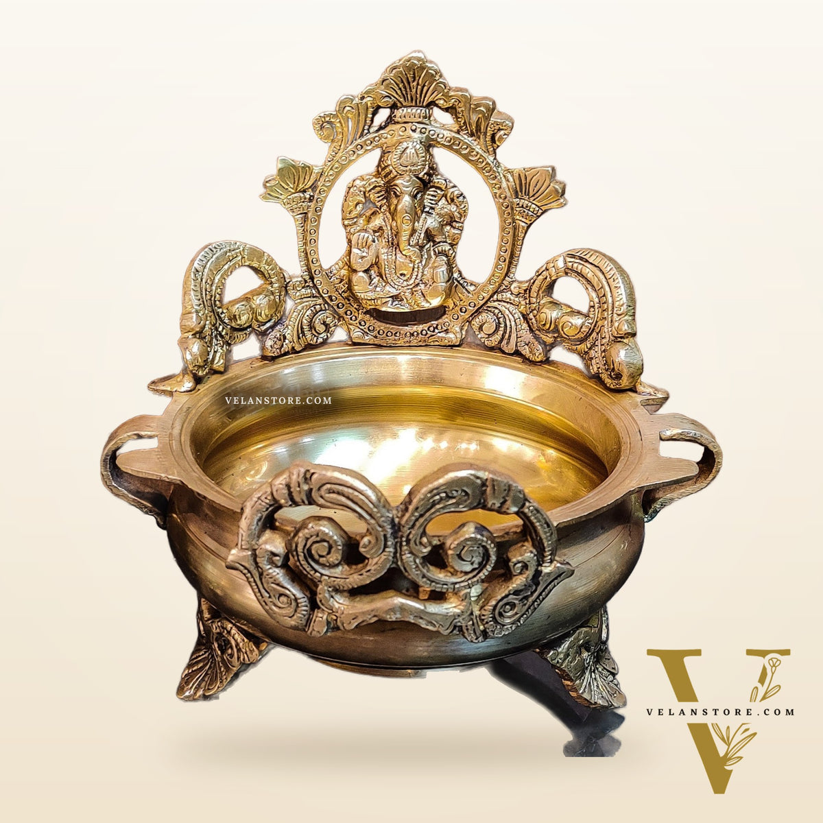 Divine Pair: Lord Ganesha and Goddess Lakshmi Brass Statues on Decorative Urli