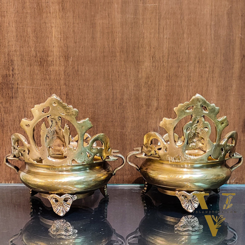 Divine Pair: Lord Ganesha and Goddess Lakshmi Brass Statues on Decorative Urli