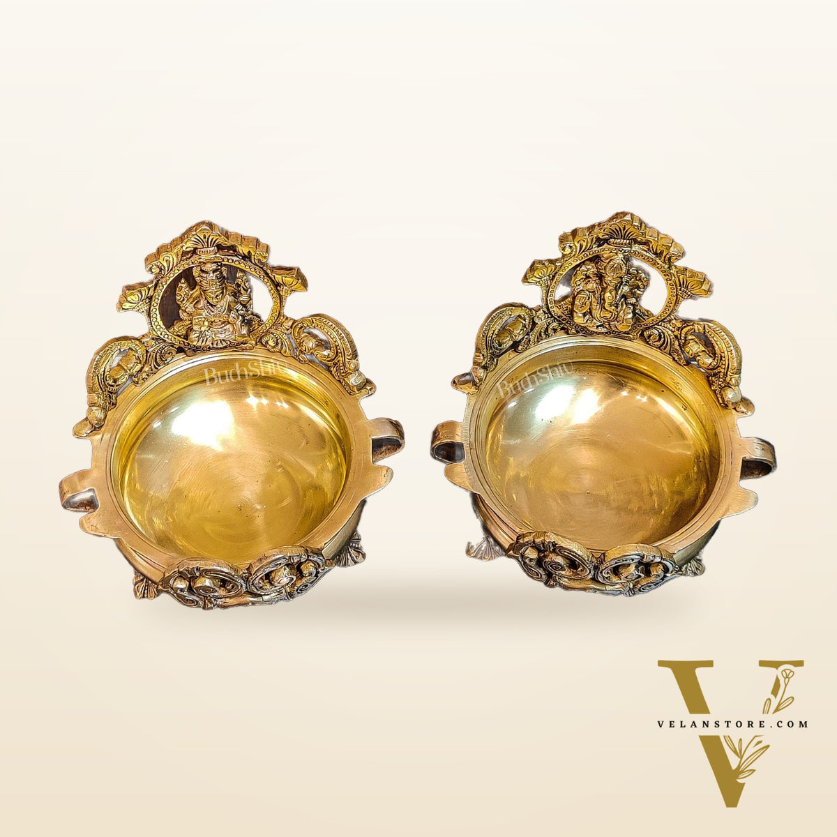 Divine Pair: Lord Ganesha and Goddess Lakshmi Brass Statues on Decorative Urli