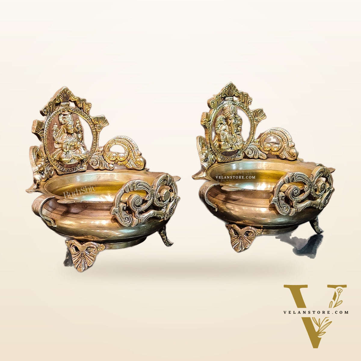 Divine Pair: Lord Ganesha and Goddess Lakshmi Brass Statues on Decorative Urli