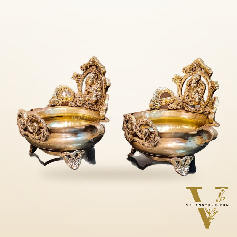 Divine Pair: Lord Ganesha and Goddess Lakshmi Brass Statues on Decorative Urli
