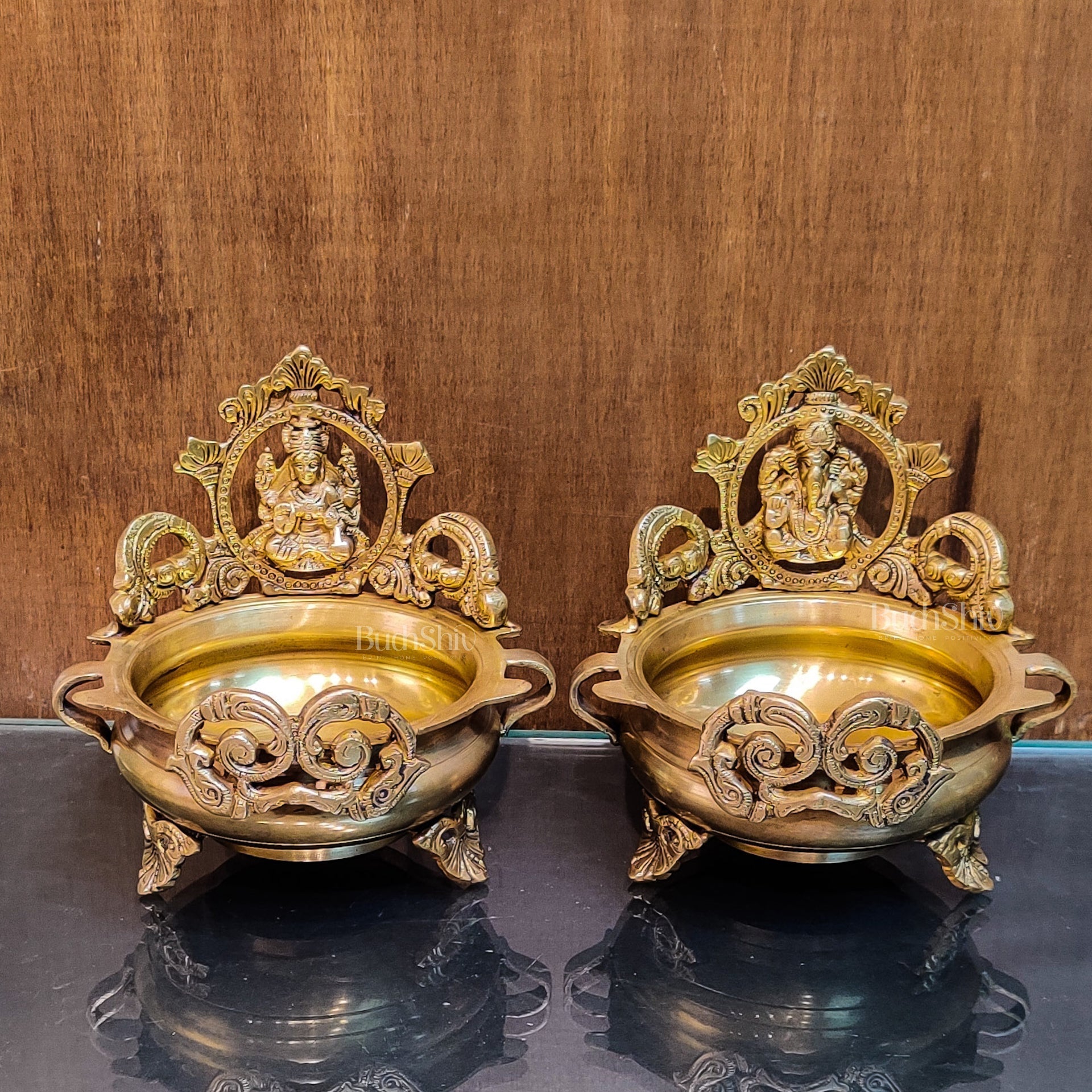 Divine Pair: Lord Ganesha and Goddess Lakshmi Brass Statues on Decorative Urli