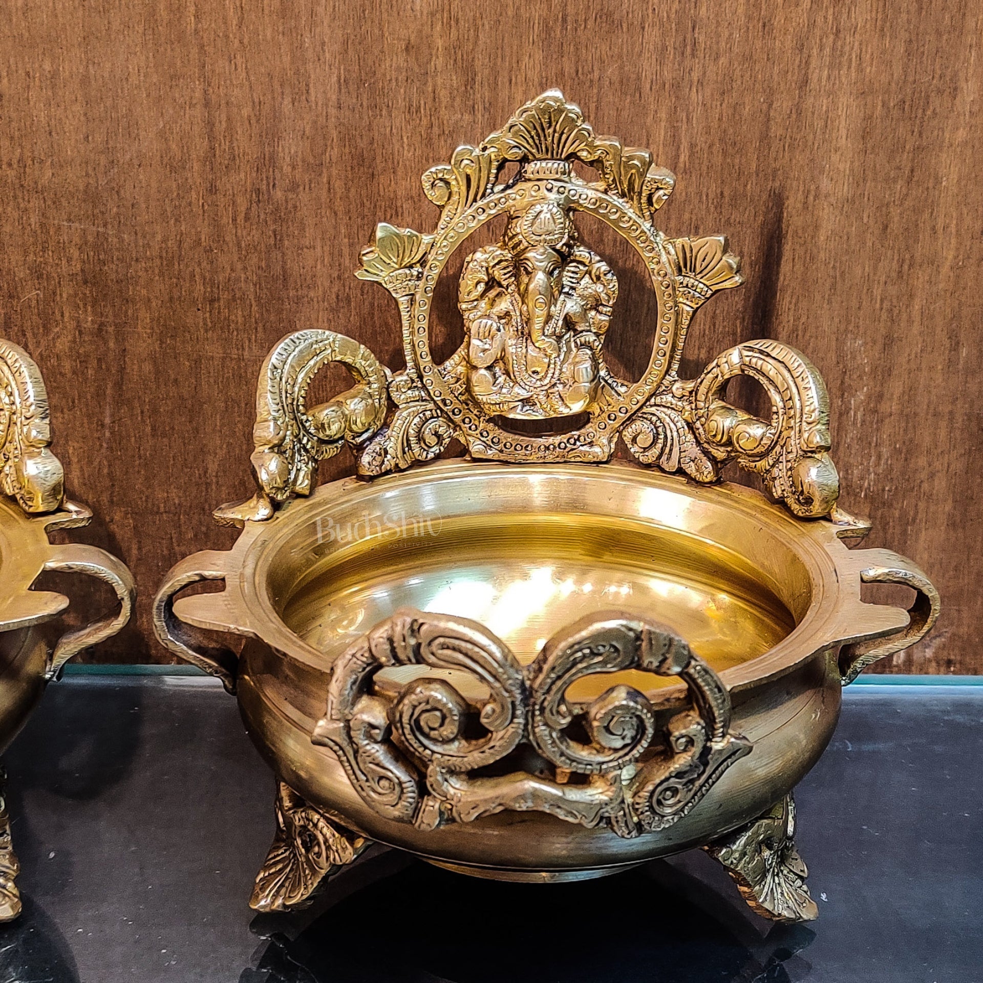 Divine Pair: Lord Ganesha and Goddess Lakshmi Brass Statues on Decorative Urli