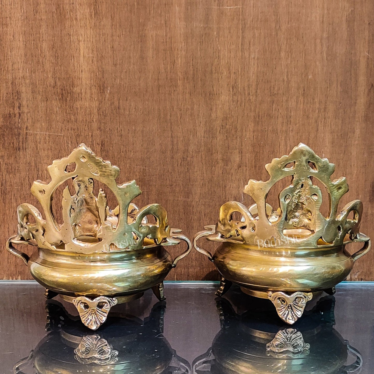 Divine Pair: Lord Ganesha and Goddess Lakshmi Brass Statues on Decorative Urli