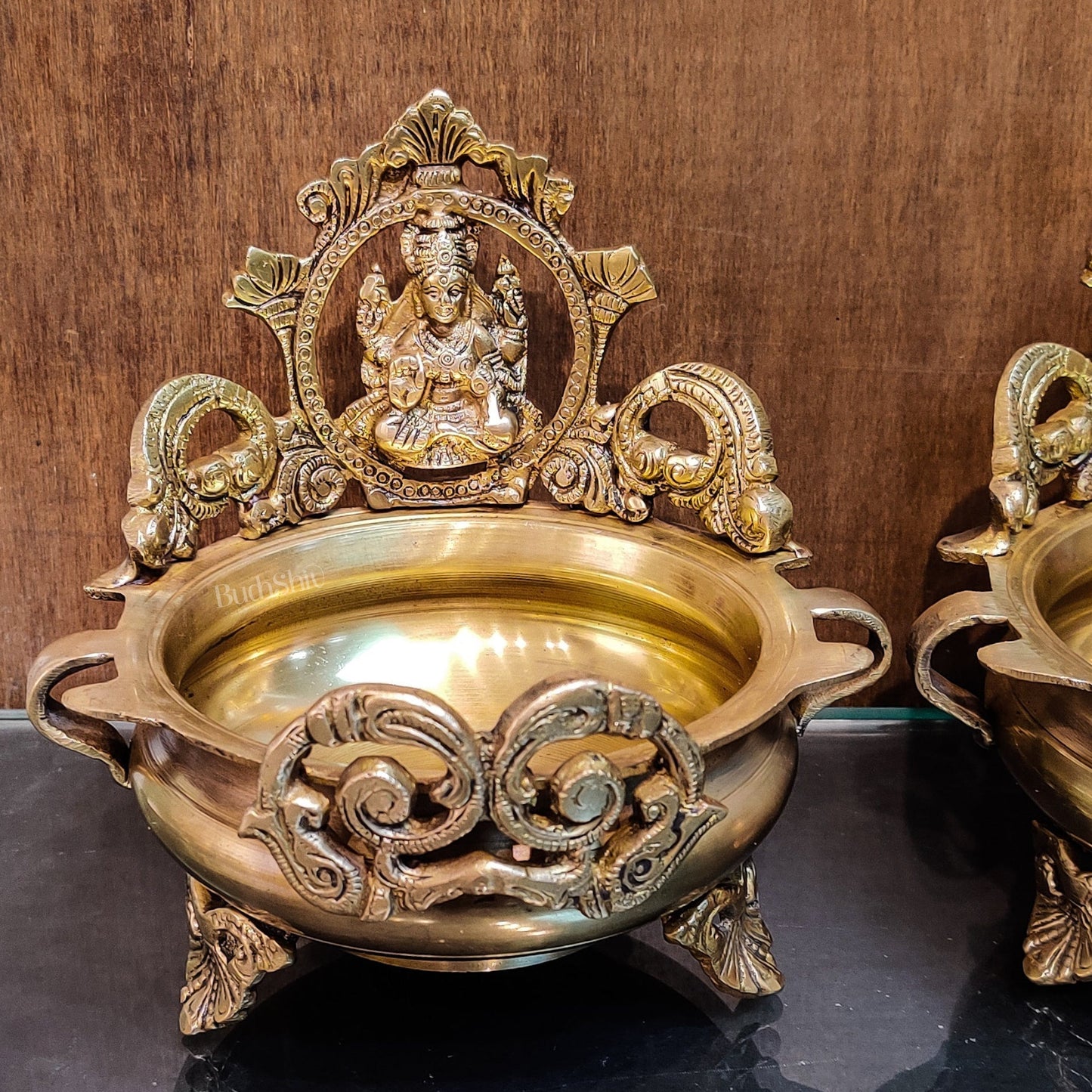 Divine Pair: Lord Ganesha and Goddess Lakshmi Brass Statues on Decorative Urli