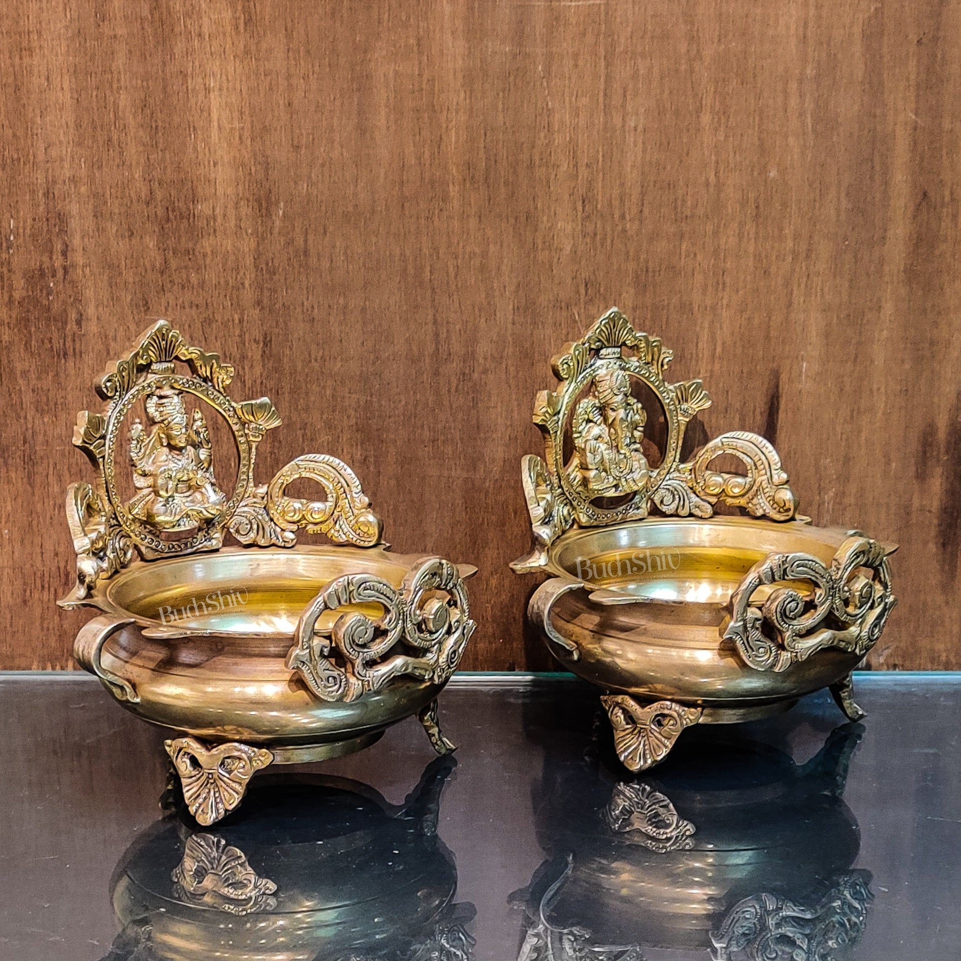Divine Pair: Lord Ganesha and Goddess Lakshmi Brass Statues on Decorative Urli