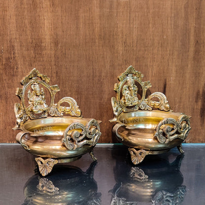 Divine Pair: Lord Ganesha and Goddess Lakshmi Brass Statues on Decorative Urli