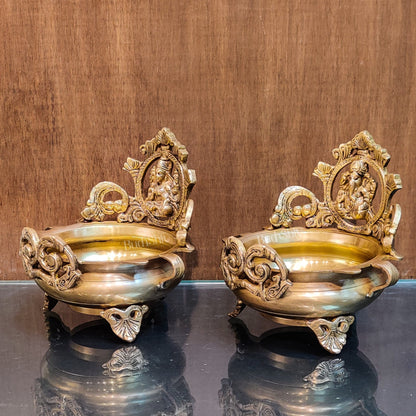 Divine Pair: Lord Ganesha and Goddess Lakshmi Brass Statues on Decorative Urli