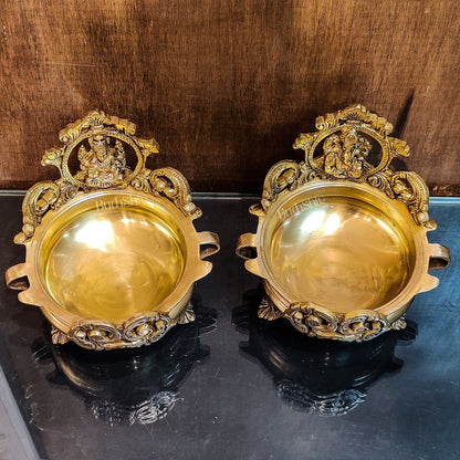 Divine Pair: Lord Ganesha and Goddess Lakshmi Brass Statues on Decorative Urli