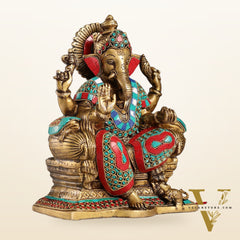 Ganesha on a sofa embossed brass idol 10 inch