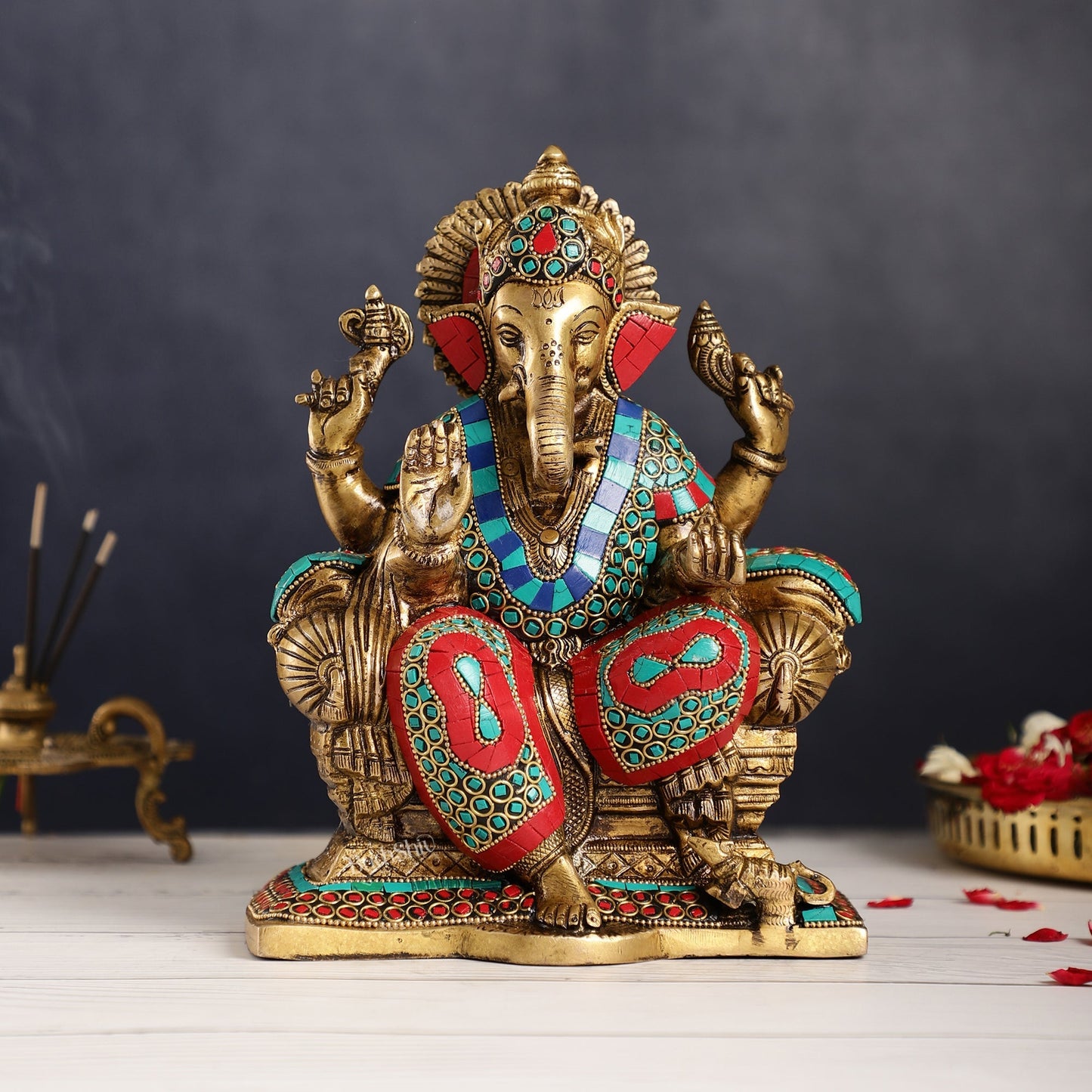 Ganesha on a sofa embossed brass idol 10 inch