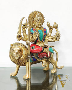 Goddess Durga brass idol with 8 arms sitting on lion with stonework 9 inches