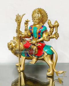 Goddess Durga brass idol with 8 arms sitting on lion with stonework 9 inches