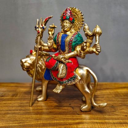 Goddess Durga brass idol with 8 arms sitting on lion with stonework 9 inches