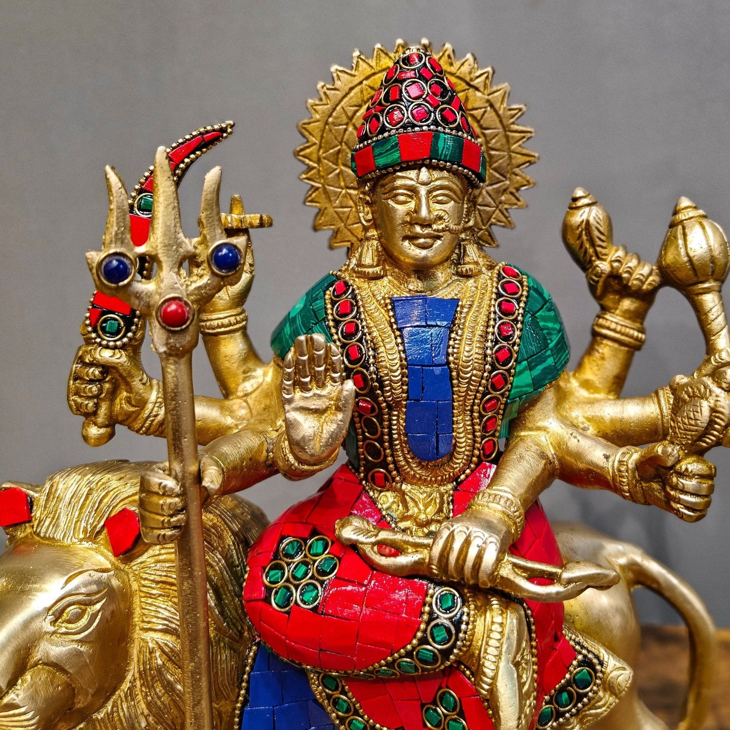 Goddess Durga brass idol with 8 arms sitting on lion with stonework 9 inches